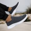Newness Urban Trek Mens Slip On Sneakers in stylish minimalist design showcasing breathable comfort and effortless style