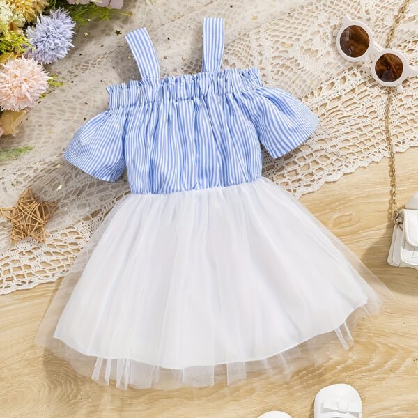 Adorable baby girl wearing a cute and playful summer stripe sundress, perfect for playtime.