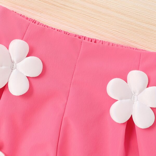 Adorable Summer Bloom Girls Shorts Set in a cheerful floral print, perfect for sunny summer days. The set includes a top and shorts.