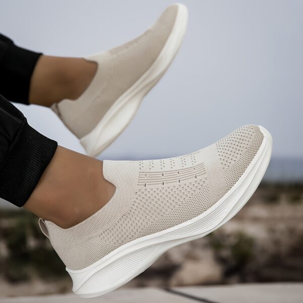 Newness Urban Trek Mens Slip On Sneakers in stylish minimalist design showcasing breathable comfort and effortless style