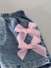 Adorable girls denim set with sweetheart neckline and bow detail perfect for playdates or school