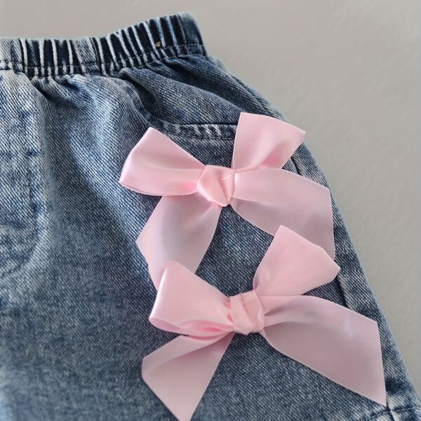 Adorable girls denim set with sweetheart neckline and bow detail, perfect for playdates or school.