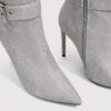 Newness Ascension Stiletto Buckle Boots Elevate your look with these stunning stiletto boots featuring a chic buckle detail