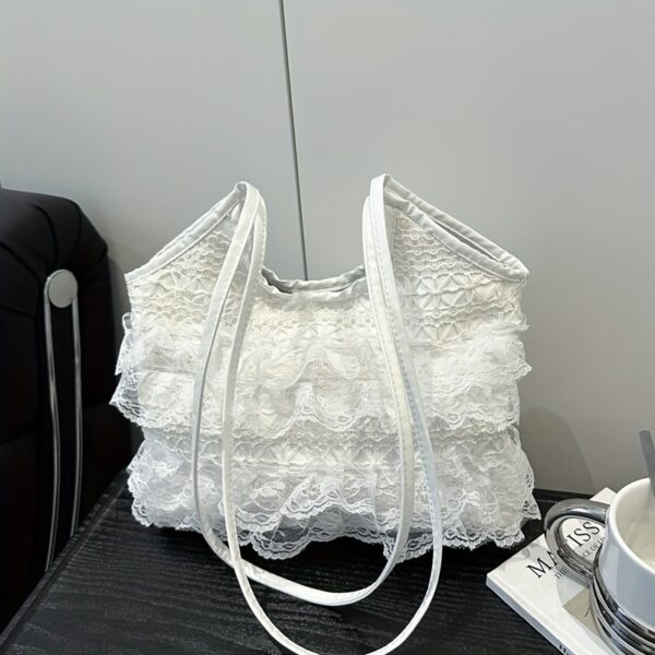 Newness Casablanca Lace Tote Bag: A stunning white lace tote bag, perfect for everyday use or travel. Showcases intricate lace detailing and roomy interior.
