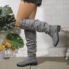 Newness Slouchy Knee High Boots in brown leather showcasing a chic and casual style perfect for winter The boots are slouchy and knee high highlighting their comfortable and fashionable design