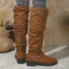 Newness Slouchy Knee High Boots in brown leather showcasing a chic and casual style perfect for winter The boots are slouchy and knee high highlighting their comfortable and fashionable design