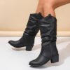 Newness Sunset Rider Ruched Cowboy Boots Brown leather cowboy boots with ruched detailing shown from the side in a lifestyle shot