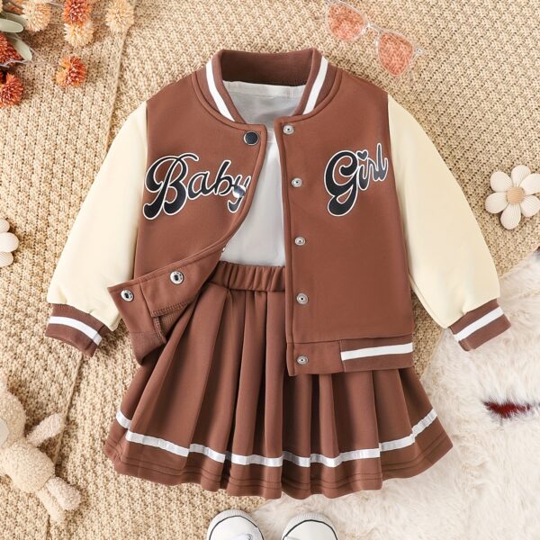 Stylish girls' preppy patchwork baseball jacket and skirt set, perfect for fall and winter. Features a mix of colorful patches on a comfortable jacket and matching skirt.
