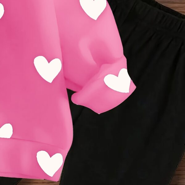 Adorable girls' playful set featuring a sweet heart print, perfect for fall and winter. The outfit includes [mention pieces included, e.g., a sweater and leggings] in soft, comfortable fabrics.