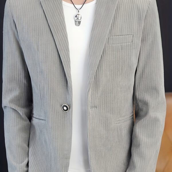 The Cairo Men's Corduroy Blazer in deep brown, a sophisticated and stylish men's blazer made from premium corduroy, perfect for any occasion. Model wearing the blazer.