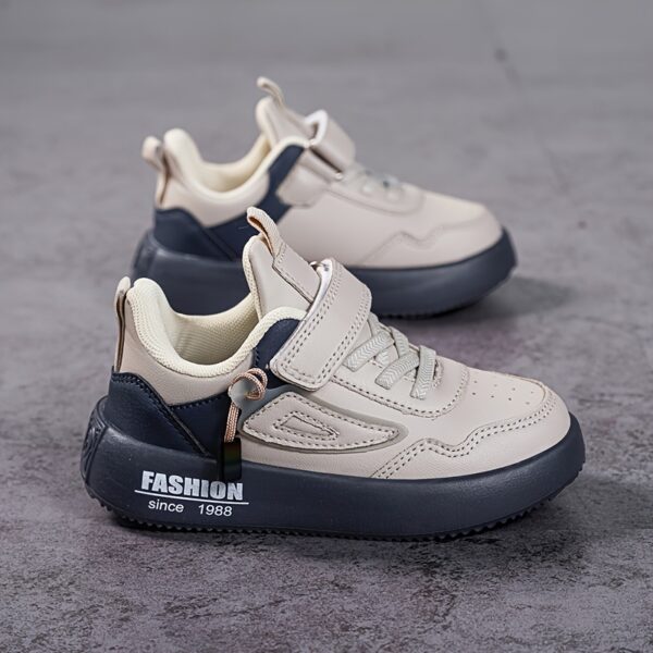 Stylish boy's retro sneakers in white with colorful tassels, perfect for everyday wear.