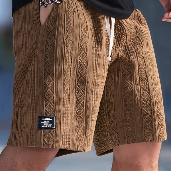 Stylish geometric knit shorts in a breathable fabric, perfect for summer adventures. Model is wearing Newness Urban Explorer Geometric Knit Shorts.