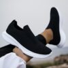 Newness Urban Trek Mens Slip On Sneakers in stylish minimalist design showcasing breathable comfort and effortless style