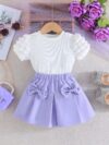Adorable Pastel Dream Girls Summer Set featuring a pastel colored top and bottom perfect for summer The outfit is shown on a young girl highlighting its comfortable and stylish design