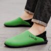 Newness Lian Di Mens Slip On Loafers in navy blue showcasing their breathable design and effortless style Perfect for any occasion