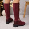 Newness Crimson V Chain Burgundy Knee Boots Elevate your style with these luxurious burgundy knee high boots featuring a striking V chain detail