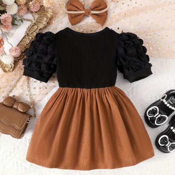 Adorable summer girls' pinstripe bow dress set from Newness. Two-piece outfit perfect for playtime. Features a stylish pinstripe pattern and a cute bow detail.