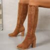 Newness Uptown Girl Knee High Boots Stylish brown leather knee high boots with a pointed toe and block heel perfect for elevating any outfit