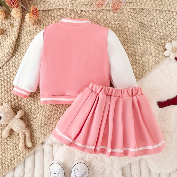 Stylish girls' preppy patchwork baseball jacket and skirt set, perfect for fall and winter. Features a mix of colorful patches on a comfortable jacket and matching skirt.