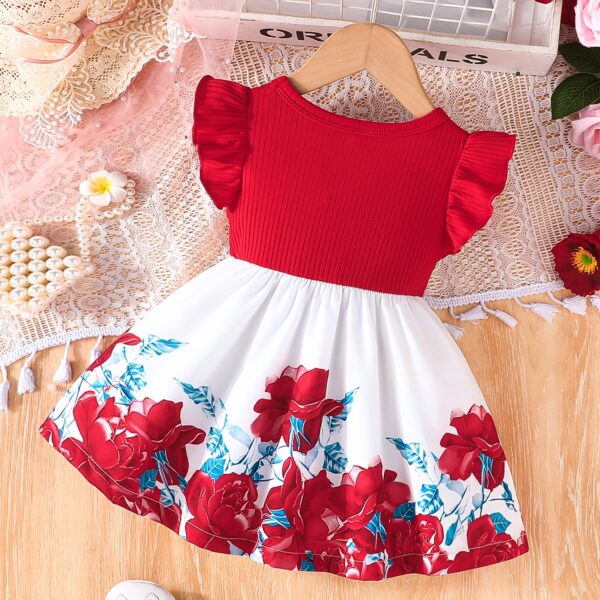 A little girl wearing a charming summer floral print dress.
