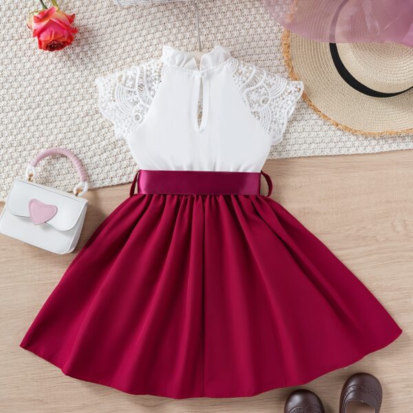 Adorable girl wearing a white Summer Bloom Lace Trim Dress, showcasing its delicate lace details and summery style.