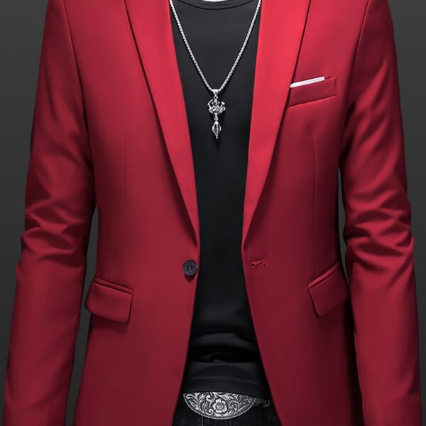 The Newness City Slicker Slim Fit Blazer: A sophisticated navy blazer in a slim fit, ideal for the modern man. Shown on a model in a stylish setting.