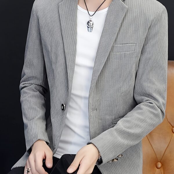 The Cairo Men's Corduroy Blazer in deep brown, a sophisticated and stylish men's blazer made from premium corduroy, perfect for any occasion. Model wearing the blazer.