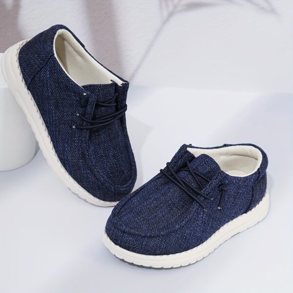 Stylish and comfortable Coastal Breeze boys canvas sneakers in blue, perfect for everyday adventures. The sneakers feature a classic design with comfortable canvas material.