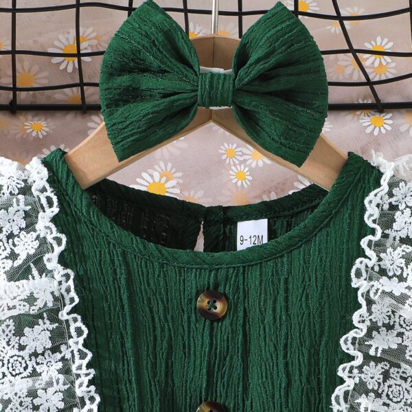 Toddler girl wearing a charming emerald green summer dress, ideal for playing outdoors.