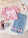 Adorable toddler girl in a stylish summer outfit featuring a cute bow Shop Newness for more childrens fashion