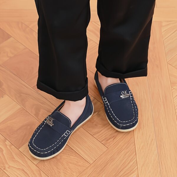 Stylish and comfortable Newness Classic Boys' Loafers, perfect for any occasion. A close-up shot showcasing the loafers' design and quality.