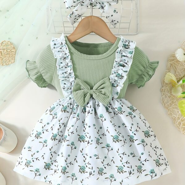 Adorable baby girl wearing a lightweight Summer Meadow floral print dress, perfect for casual summer outings.