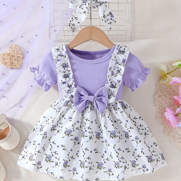 Adorable baby girl wearing a lightweight Summer Meadow floral print dress, perfect for casual summer outings.