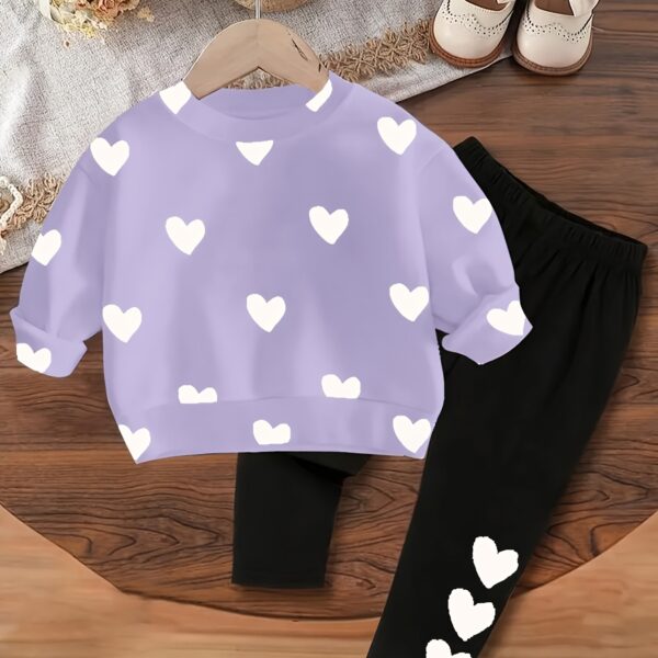 Adorable girls' playful set featuring a sweet heart print, perfect for fall and winter. The outfit includes [mention pieces included, e.g., a sweater and leggings] in soft, comfortable fabrics.