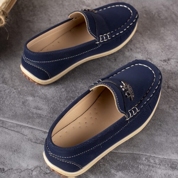 Stylish and comfortable Newness Classic Boys' Loafers, perfect for any occasion. A close-up shot showcasing the loafers' design and quality.