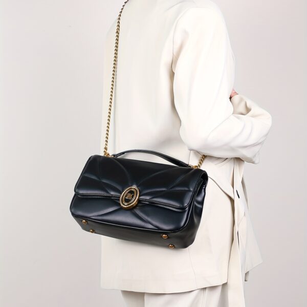 Newness Uptown Quilted Crossbody Bag in stylish pose, showcasing its quilted texture and compact design, perfect for everyday wear.