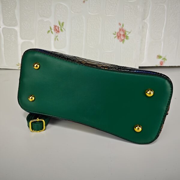 Emerald Envy Snakeskin Crossbody Bag by Newness. A chic, modern, and luxuriously designed crossbody bag in emerald green snakeskin.