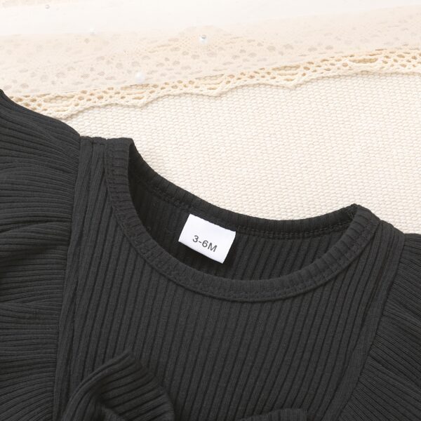 Petite Fleur: A charming girl in a floral mesh dress, twirling happily.