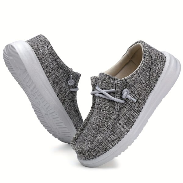 Stylish Newness Striped Canvas Kids' Slip-Ons in classic navy and white stripes. Lightweight and breathable, perfect for kids' everyday wear.