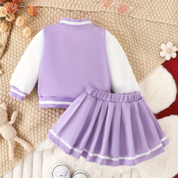 Stylish girls' preppy patchwork baseball jacket and skirt set, perfect for fall and winter. Features a mix of colorful patches on a comfortable jacket and matching skirt.