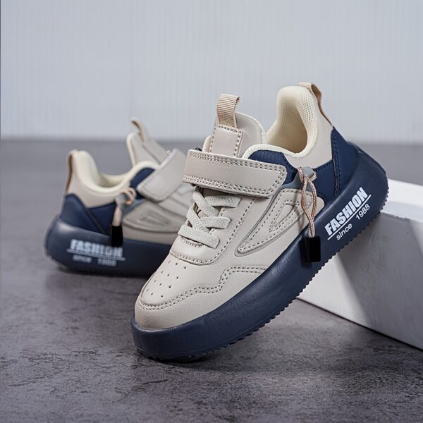 Stylish boy's retro sneakers in white with colorful tassels, perfect for everyday wear.