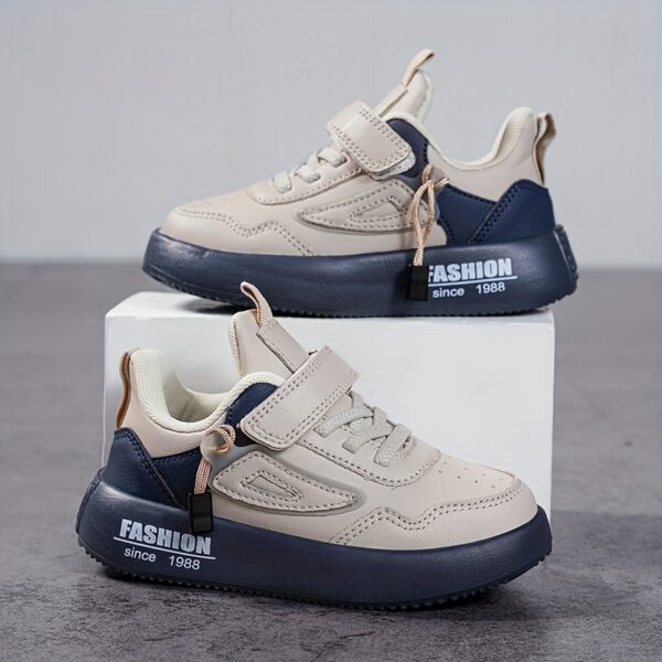 Stylish boy's retro sneakers in white with colorful tassels, perfect for everyday wear.