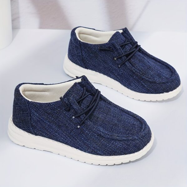 Stylish and comfortable Coastal Breeze boys canvas sneakers in blue, perfect for everyday adventures. The sneakers feature a classic design with comfortable canvas material.