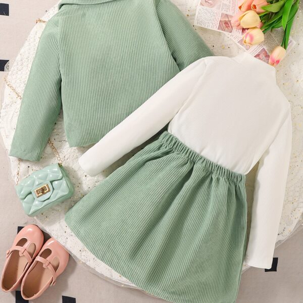 Adorable girl wearing Newness' Spring Meadow Girls' Suit Set, a stylish outfit perfect for spring, fall, or winter.