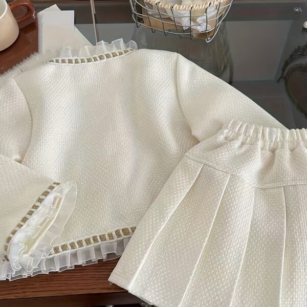 Adorable girls' skirt set in a chic, high-end design, perfect for any occasion.