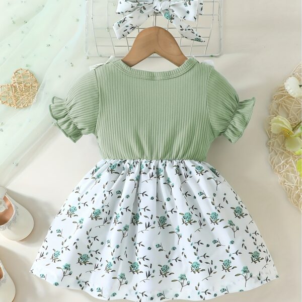 Adorable baby girl wearing a lightweight Summer Meadow floral print dress, perfect for casual summer outings.