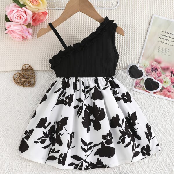 Adorable girl wearing a vibrant Summer Bloom floral print dress, perfect for summer vacations.