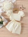 Adorable baby girl wearing a Summer Bloom floral outfit perfect for summer The outfit features a delightful floral pattern