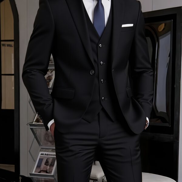 Model wearing the Newness Apex Slim Fit Tuxedo, a sophisticated black tuxedo with a modern slim fit, ideal for weddings and formal events.
