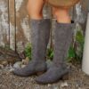 Newness Effortless Chic Winter Mid Calf Boots Stylish brown leather boots that reach mid calf perfect for any occasion The boots are shown from the side highlighting their sleek design and comfortable fit